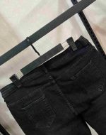 شلوار جین زنانه سایز بزرگ مدل مام‌فیت مشکی  (Distressed Black Jeans)** - Image 6
